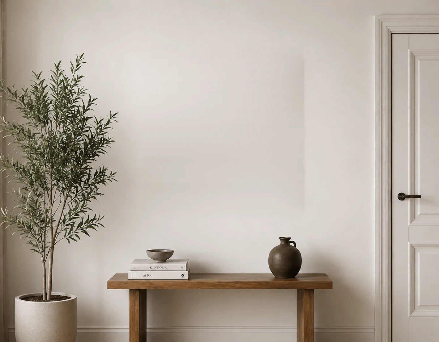 Interior with console table, plant and door